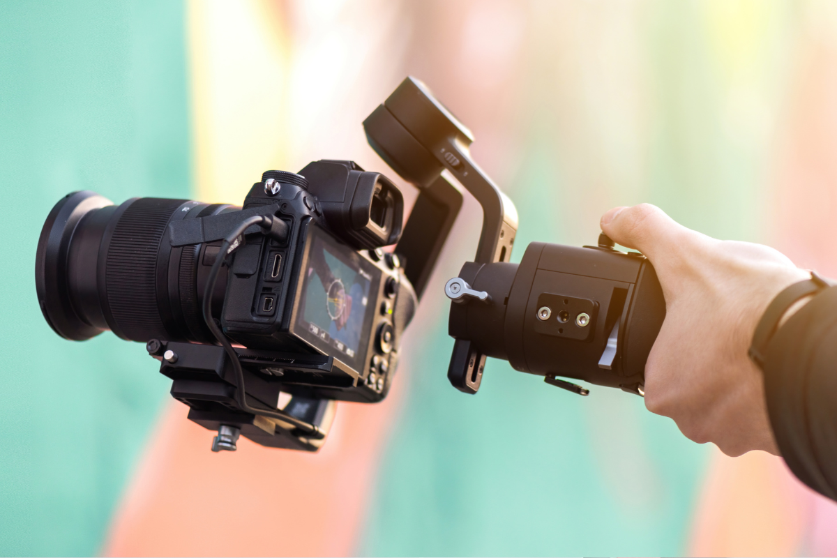 image showing persons hand holding camera